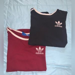 2 Adidas women’s tee shirts. One black, one maroon.